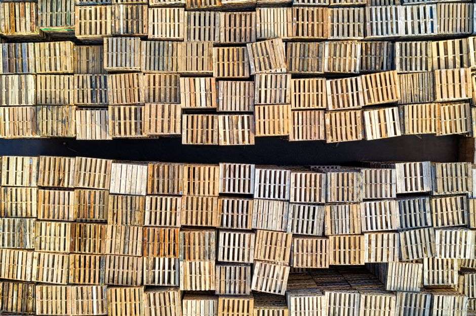 Stacked wooden pallets in a warehouse, prepared for shipment