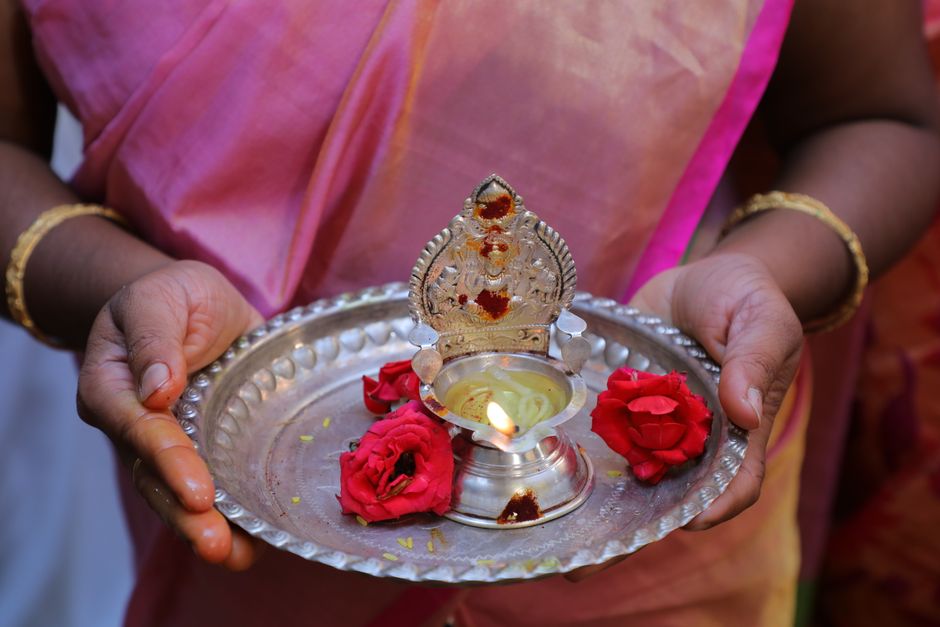 Traditional brass diya oil lamps arranged for worship